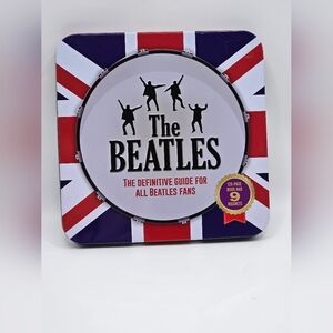 Beatles memorabilia set featuring a 128-page book and 6 magnets